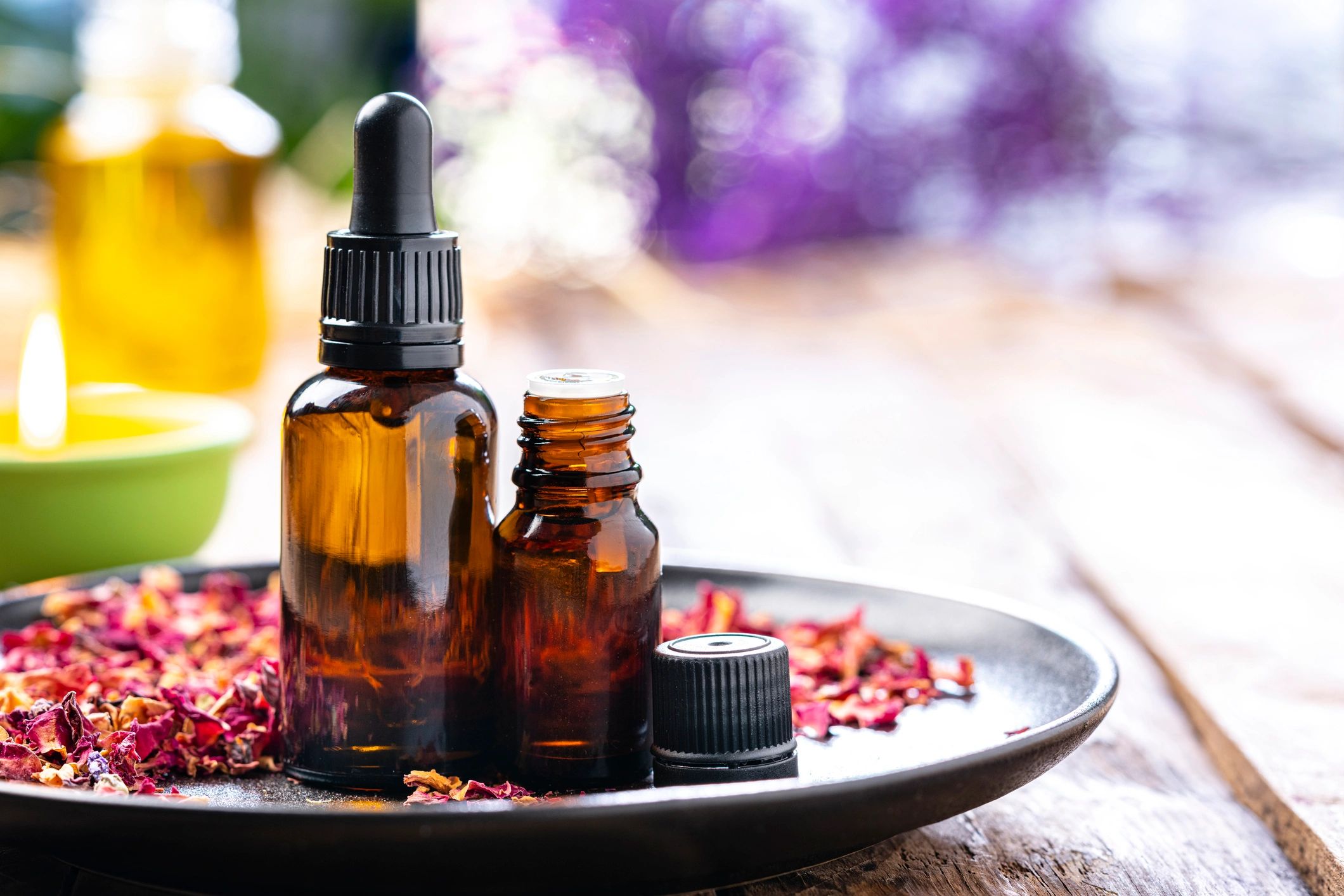 Essential oil bottles on a wooden table