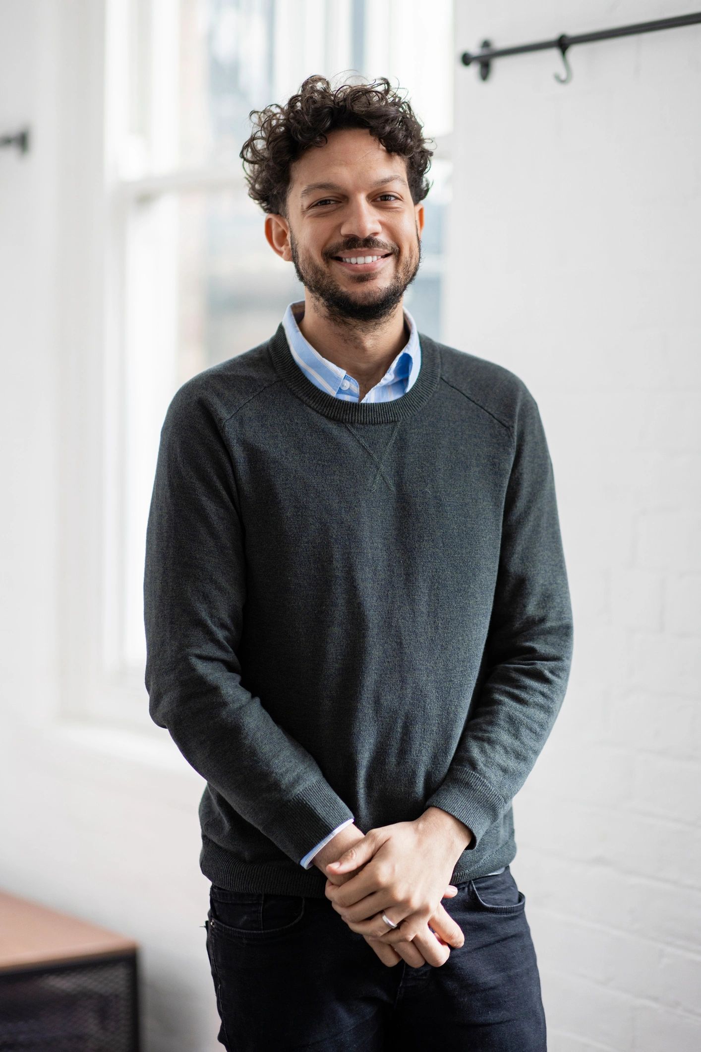 Professional headshot representing research role